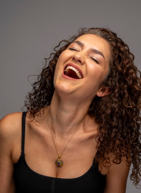 A woman laughing.